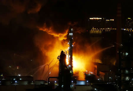 Fire and smoke are seen at state oil major PetroChina's plant in Dalian, Liaoning province, China August 17, 2017. REUTERS/Stringer