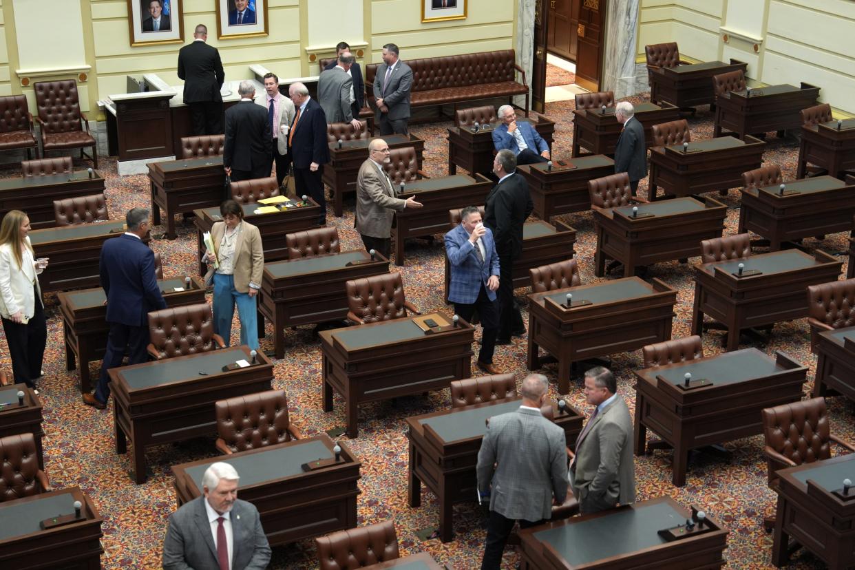 Lawmakers mingle after a Senate special session convenes Wednesday at the state Capitol.