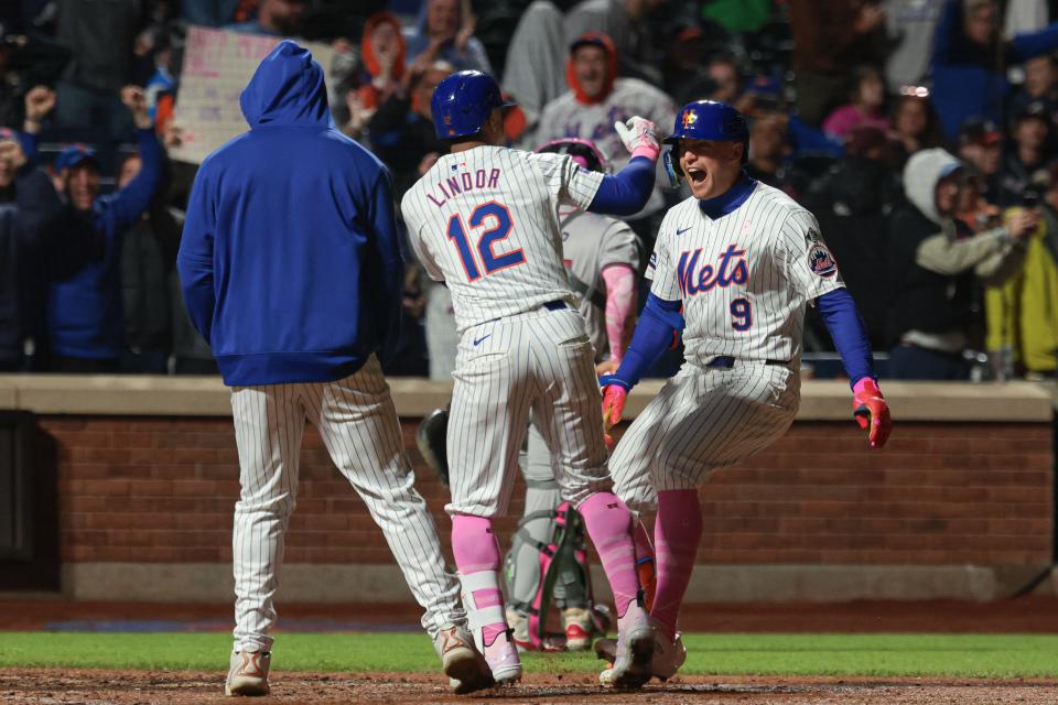New York Mets left fielder Brandon Nimmo (9) celebrates with shortstop Francisco Lindor (12) after hitting a walk-off two run home run to defeat the Atlanta Braves on May 12, 2024, at Citi Field.