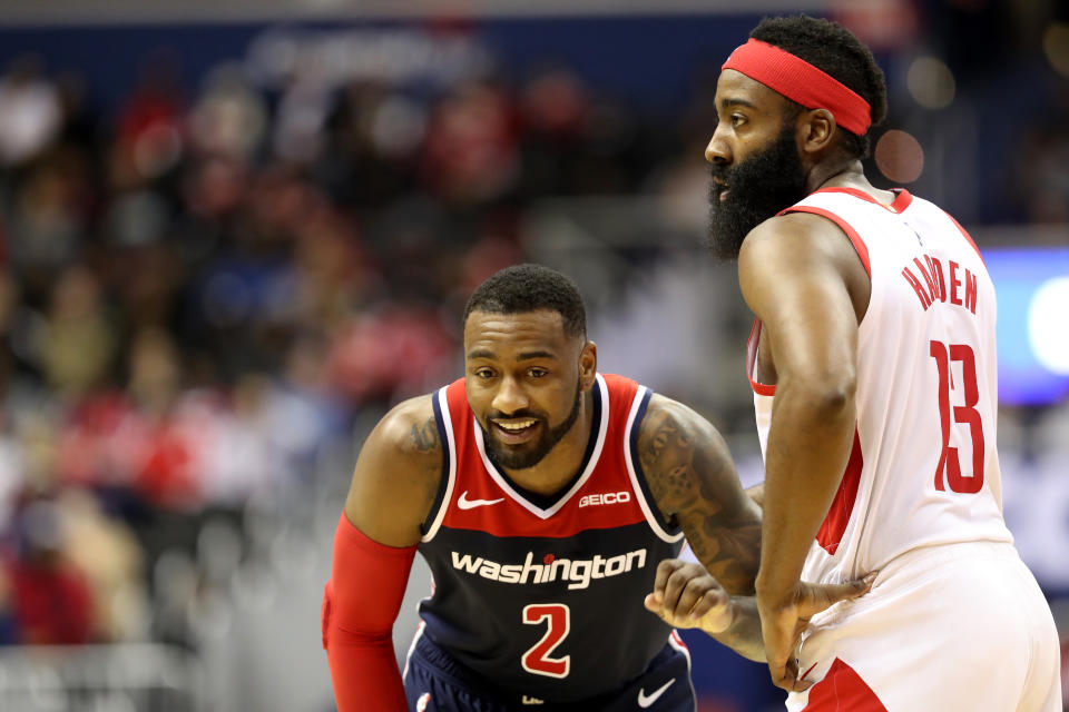 John Wall #2 of the Washington Wizards talks with James Harden #13 of the Houston Rockets in the second half at Capital One Arena on November 26, 2018 in Washington, DC. NOTE TO USER: User expressly acknowledges and agrees that, by downloading and or using this photograph, User is consenting to the terms and conditions of the Getty Images License Agreement. (Photo by Rob Carr/Getty Images)