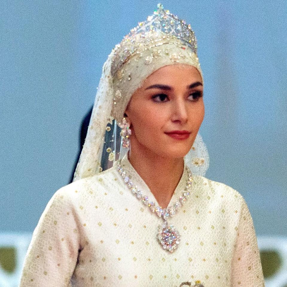 Prince Mateen of Brunei's new wife Anisha channels Princess Kate in dazzling caped wedding guest dress