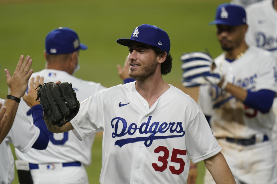 Los Angeles Dodgers center fielder Cody Bellinger celebrates their win against the Tampa Bay Rays in Game 1 of the baseball World Series Tuesday, Oct. 20, 2020, in Arlington, Texas. The Dodgers defeated the Rays 8-3 to lead the series 1-0 games. (AP Photo/Eric Gay)