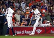 Sep 18, 2018; Houston, TX, USA; Houston Astros left fielder Marwin Gonzalez (9) celebrates with third base coach Gary Pettis (8) after hitting a home run during the third inning against the Seattle Mariners at Minute Maid Park. Mandatory Credit: Troy Taormina-USA TODAY Sports