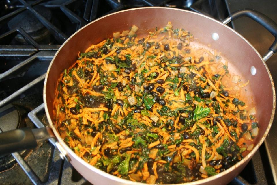 Sauté onions, kale, sweet potatoes, black beans with seasoning and oil for your enchilada filling.