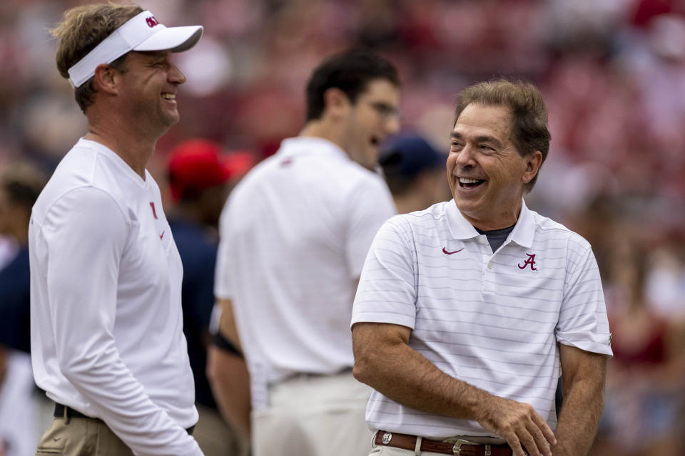 Mississippi head coach Lane Kiffin, left, and Alabama head coach Nick Saban laugh as they talk before an NCAA college football game, Saturday, Oct. 2, 2021, in Tuscaloosa, Ala. (AP Photo/Vasha Hunt)