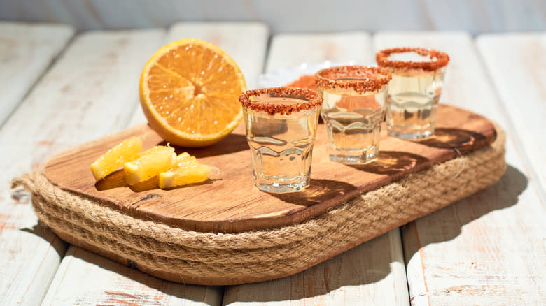 Shots of mezcal with orange