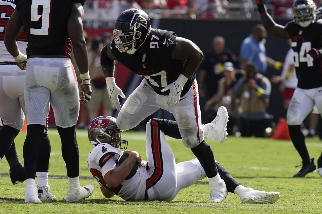 Atlanta Falcons defensive end Grady Jarrett takes down Tampa Bay Buccaneers quarterback Tom Brady