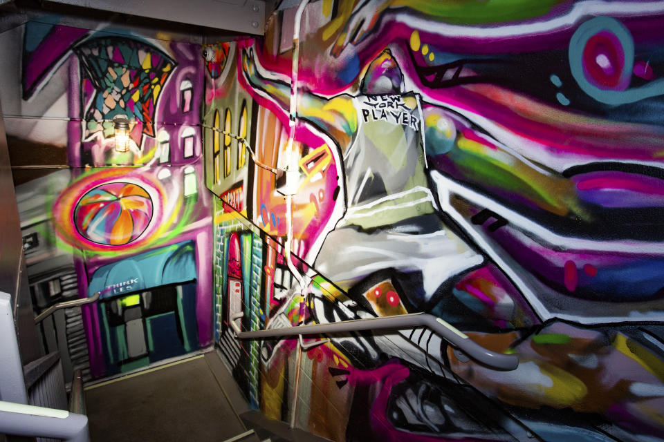 This photo provided by citizenM Hotel shows a stairwell enhanced with graffiti art in their Bowery property in New York. The hotel commissioned the graffiti artists who formerly worked in Queens' 5 Pointz studios, before a catastrophic fire. Their custom works not only enliven the stairwells, but have created a new Museum of Street Art for guests and neighbors to enjoy. (Christian Johnson/citizenM via AP)