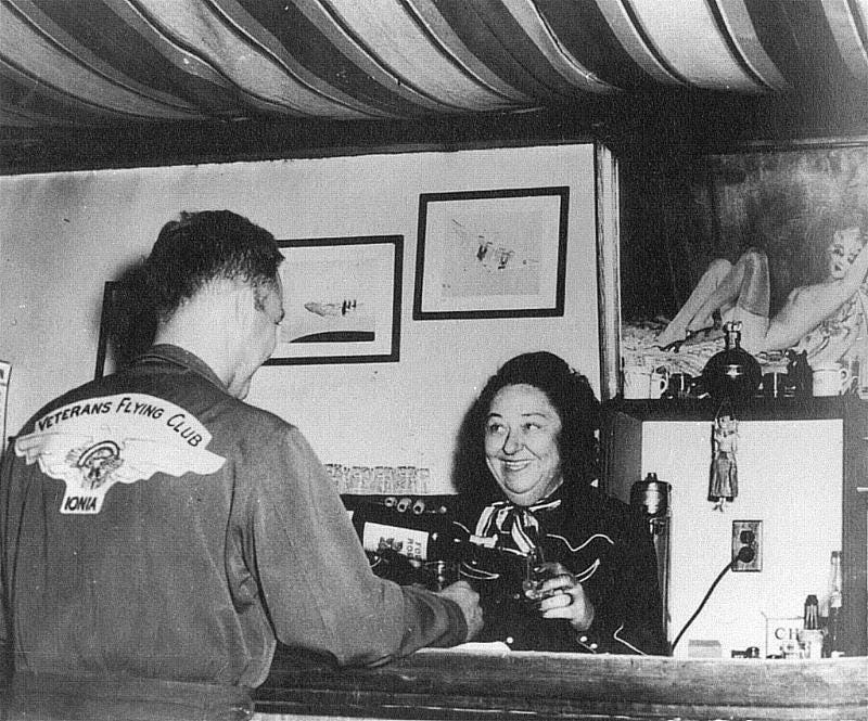 Pancho serving drinks behind her bar in California.