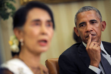 U.S. President Barack Obama listen as Myanmar's State Counsellor Aung San Suu Kyi talks to the media during a bilateral meeting at the Oval Office of the White House in Washington, D.C., U.S. September 14, 2016. REUTERS/Carlos Barria