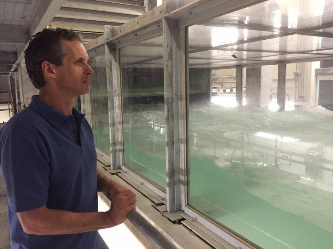 Brian Haus, professor in the department of ocean sciences at the UM Rosenstiel School of Marine, Atmospheric, and Earth Science in Miami, looks on as a storm rages inside the world’s largest indoor hurricane simulator, known as SUSTAIN (short for SUrge-STructure-Atmosphere Interaction) on April 30, 2015.