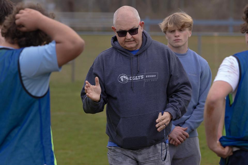 Rugby Coach Pat Moroney explains strategy as the team practices. Christian Brothers Academy Rugby team practices as they prepare for a 10 day trip to Ireland over Spring Break. Practice was in Lincroft on May 28, 2023. 