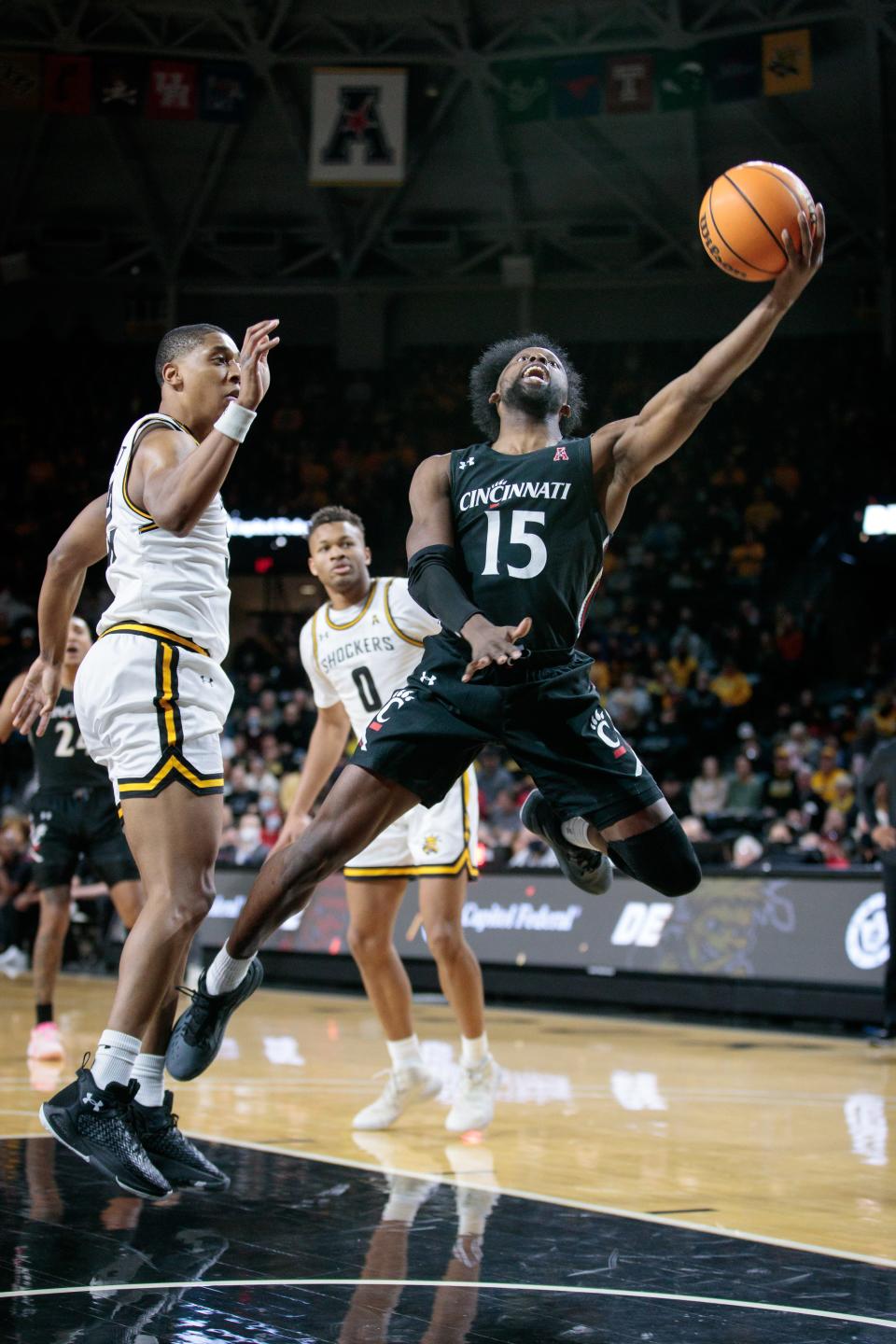 Jan 12, 2022; Wichita, Kansas, USA; Cincinnati Bearcats forward John Newman III (15) puts up a shot during the first half against the Wichita State Shockers  at Charles Koch Arena.