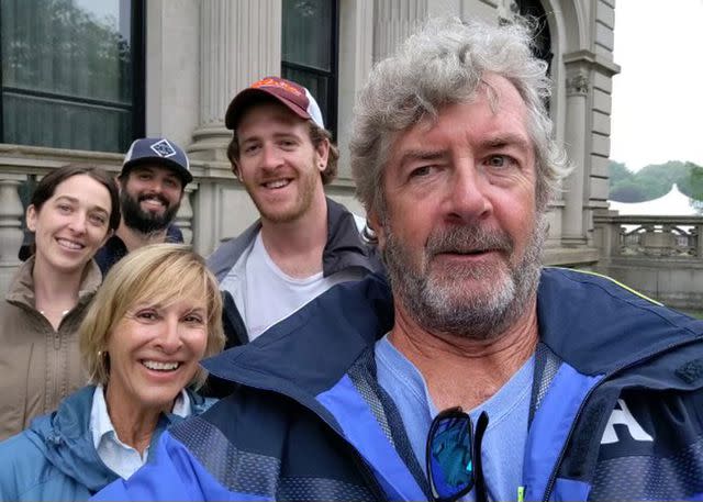 <p>Courtesy of Nick Buro</p> Ralph Hendry and Kathy Brandel with their sons Bryan Hendry and Nick Buro, who is pictured behind his partner, Kerri Fennelly.