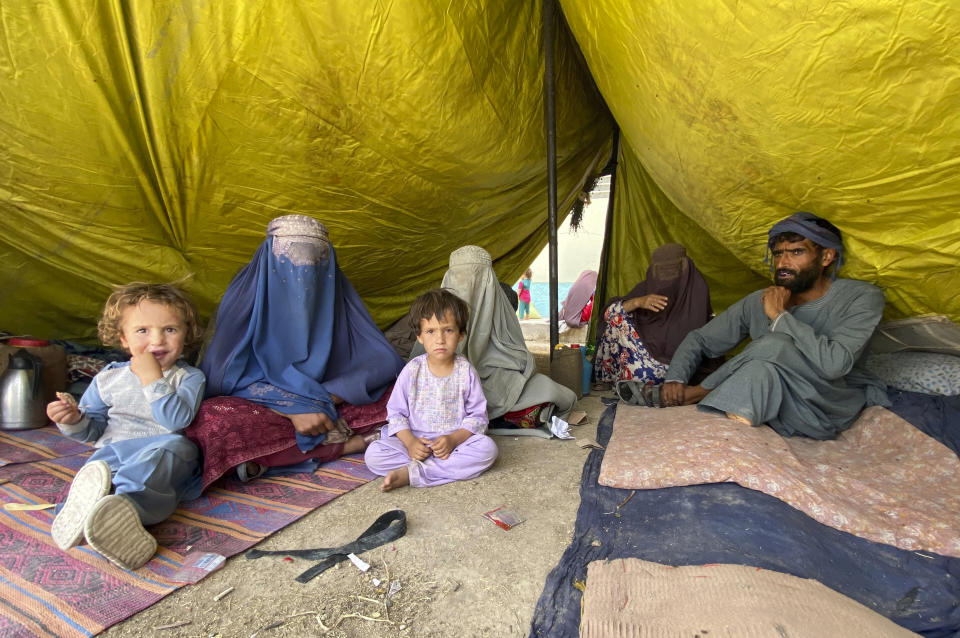 Internally displaced Afghans who fled their home due to fighting between the Taliban and Afghan security personnel, are seen at a camp in Daman district of Kandahar province south of Kabul, Afghanistan, Thursday, Aug. 5, 2021. (AP Photo/Sidiqullah Khan)