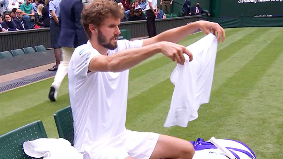 Oscar Otte, pictured here struggling with the shorts he was wearing at Wimbledon.