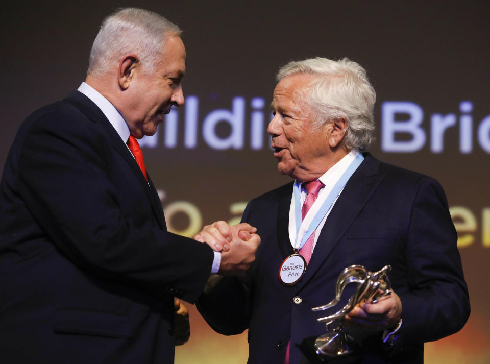 New England Patriots owner Robert Kraft, right, receives Genesis Prize from Israeli Prime Minister Benjamin Netanyahu in Jerusalem, Thursday, June 20, 2019. Israel honored Kraft with the 2019 Genesis Prize for his philanthropy and commitment to combatting anti-Semitism. (AP Photo/Sebastian Scheiner)