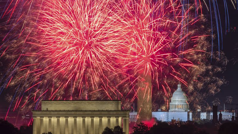 Fireworks burst on the National Mall above the Lincoln Memorial, Washington Monument and the U.S. Capitol building during Independence Day celebrations in Washington, Monday, July 4, 2022.