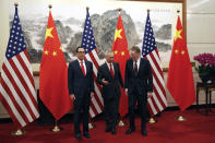 Chinese Vice Premier Liu He, center, chats with U.S. Trade Representative Robert Lighthizer, right, next to U.S. Treasury Secretary Steven Mnuchin, left, before they proceed to their meeting at the Diaoyutai State Guesthouse in Beijing, Wednesday, May 1, 2019. (AP Photo/Andy Wong, Pool)