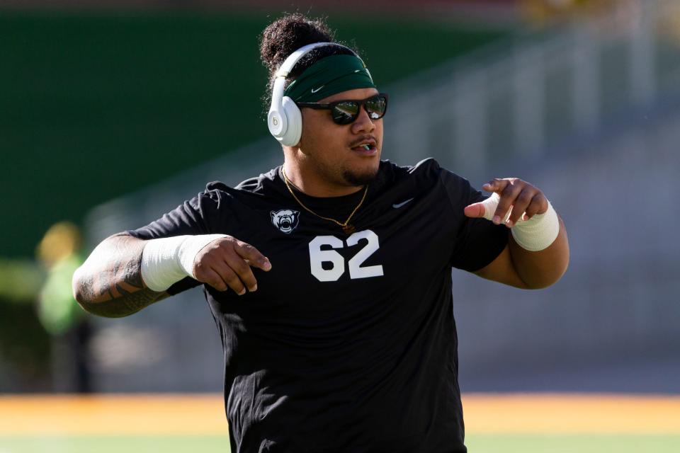 Former Baylor defensive tackle Siaki Ika (62) warms up before a game against Texas on Oct. 30, 2021.