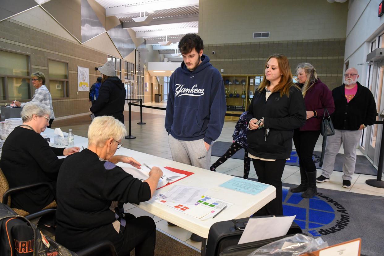 Voters arrive at their election precinct on Tuesday morning, November 8, 2022, at the Career and Technical Education Academy in Sioux Falls.