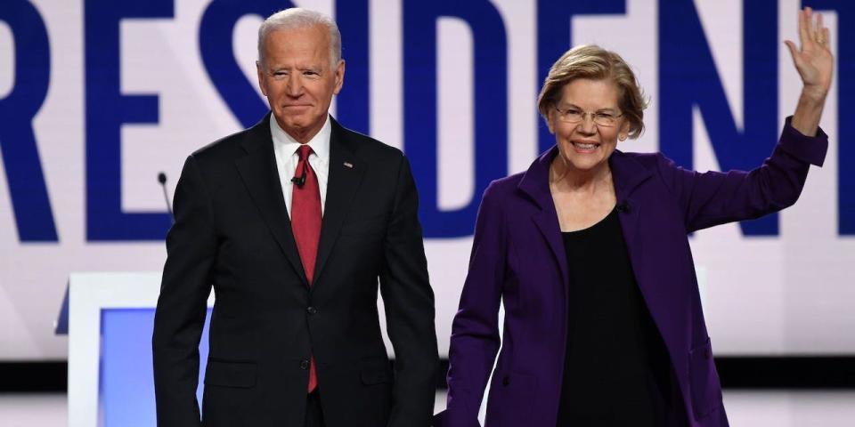 Former Vice President Joe Biden (L) and Massachusetts Senator Elizabeth Warren arrive on stage for the fourth Democratic primary debate of the 2020 presidential campaign season