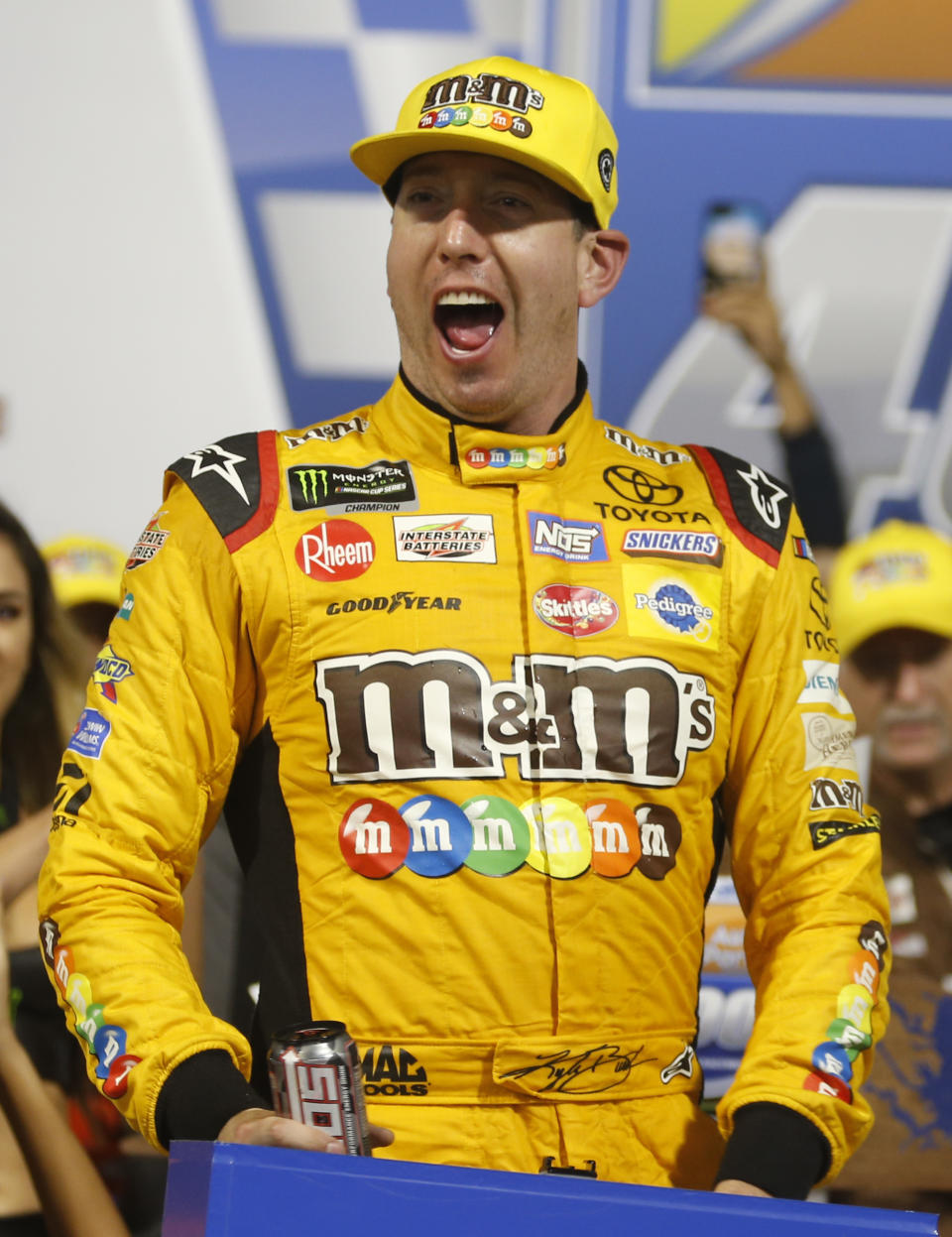 Kyle Busch (18) celebrates winning the NASCAR Cup Series auto race in victory lane at Richmond Raceway in Richmond, Va., Saturday, Sept. 22, 2018. (AP Photo/Steve Helber)