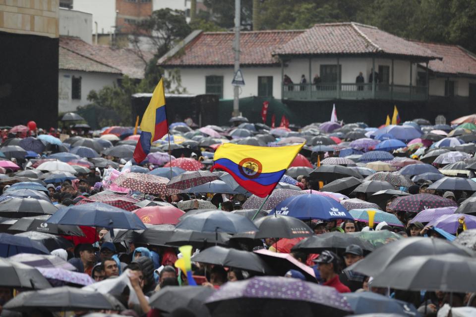Anti-government protesters rally during a nationwide strike, at Bolivar square in downtown Bogota, Colombia, Thursday, Nov. 21, 2019. Colombia's main union groups and student activists called for a strike to protest the economic policies of Colombian President Ivan Duque government and a long list of grievances. (AP Photo/Fernando Vergara)