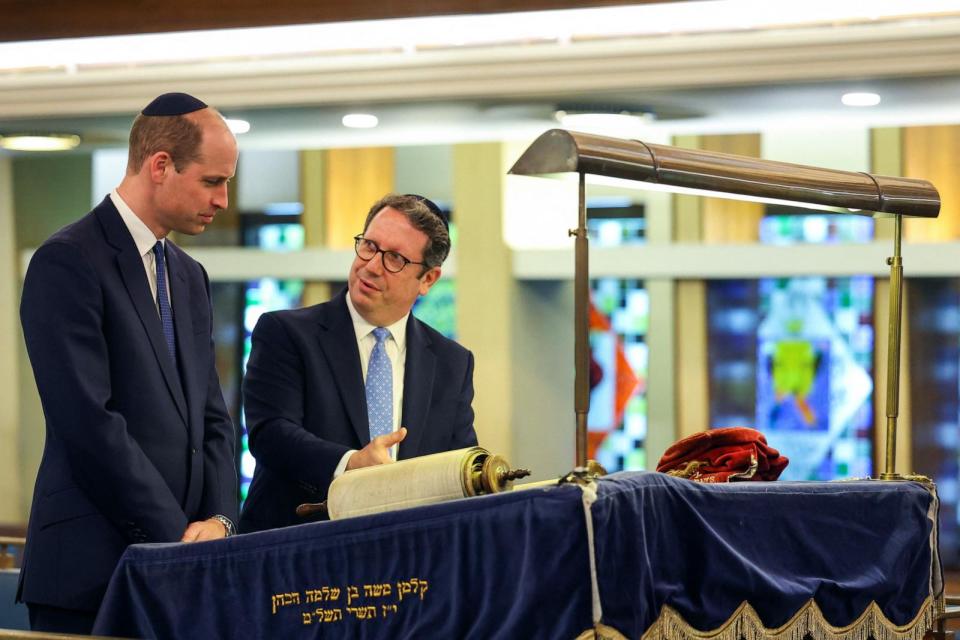 PHOTO: Rabbi Daniel Epstein shows Britain's Prince William, Prince of Wales a 17th century Torah scroll as he visits the Western Marble Arch Synagogue on February 29, 2024 in London, England. (Toby Melville/Wpa Pool/Getty Images)