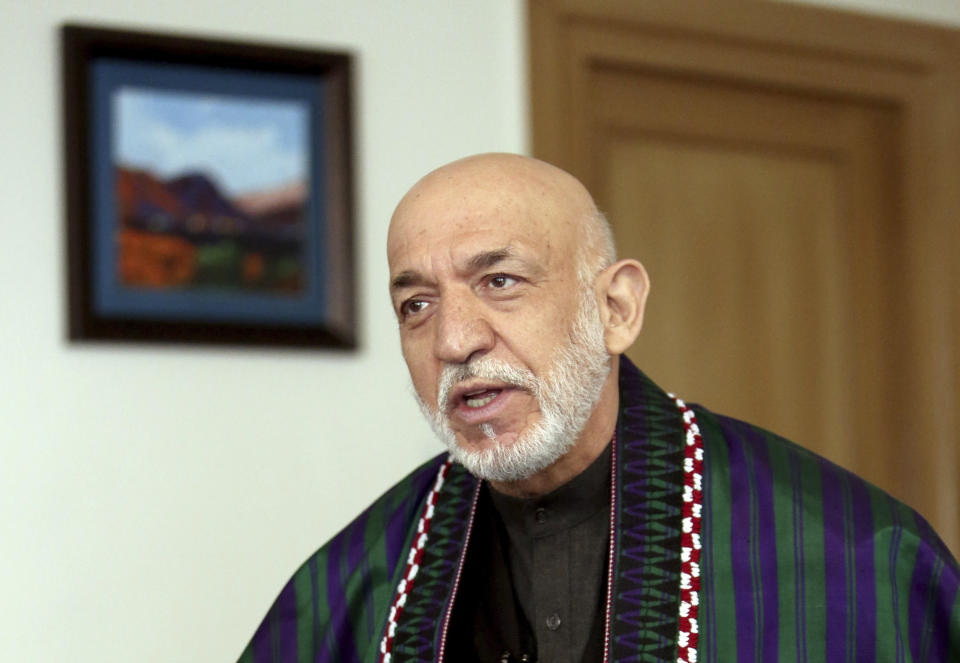 Former Afghan President Hamid Karzai speaks during an interview with The Associated Press in Kabul, Afghanistan, Friday, Feb. 28, 2020. On the eve of a potentially historic deal with the U.S. and the Taliban to end 18 years of war in Afghanistan, former Karzai welcomed the signing of the agreement, thanked Americans for their generosity, but had harsh words for the U.S. government and military. (AP Photo/Tamana Sarwary)