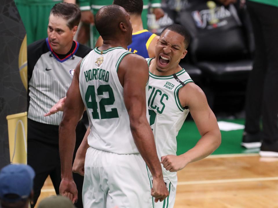 Game 6: Celtics forward Grant Williams (12) and center Al Horford (42) get fired up after a big second-half bucket.