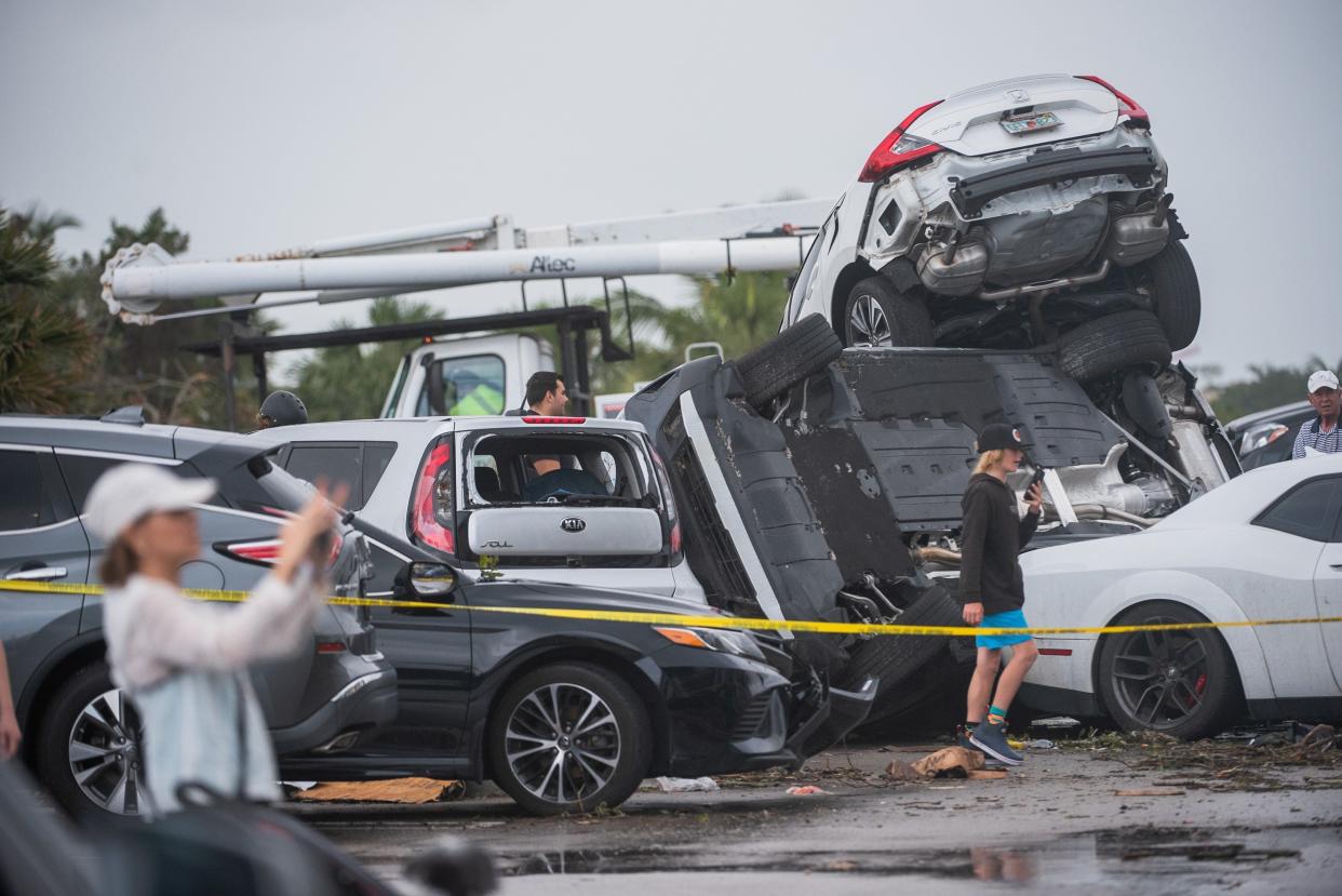 A pileup of vehicles at The Point apartment complex in the aftermath of an April 30, 2023 evening tornado in Palm Beach Gardens.