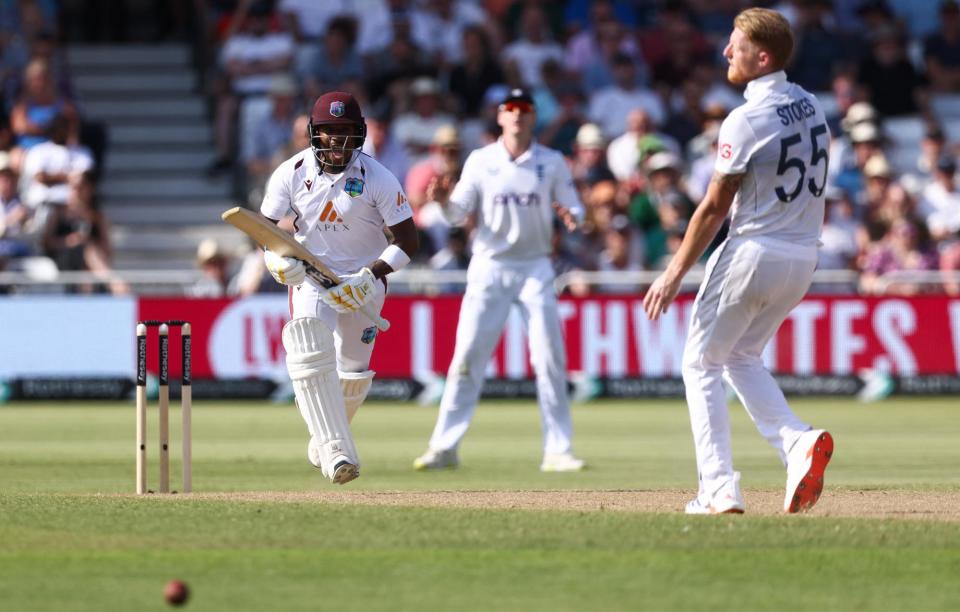 <span>Kavem Hodge (left) celebrates after hitting the runs to complete his maiden Test century.</span><span>Photograph: Darren Staples/AFP/Getty Images</span>