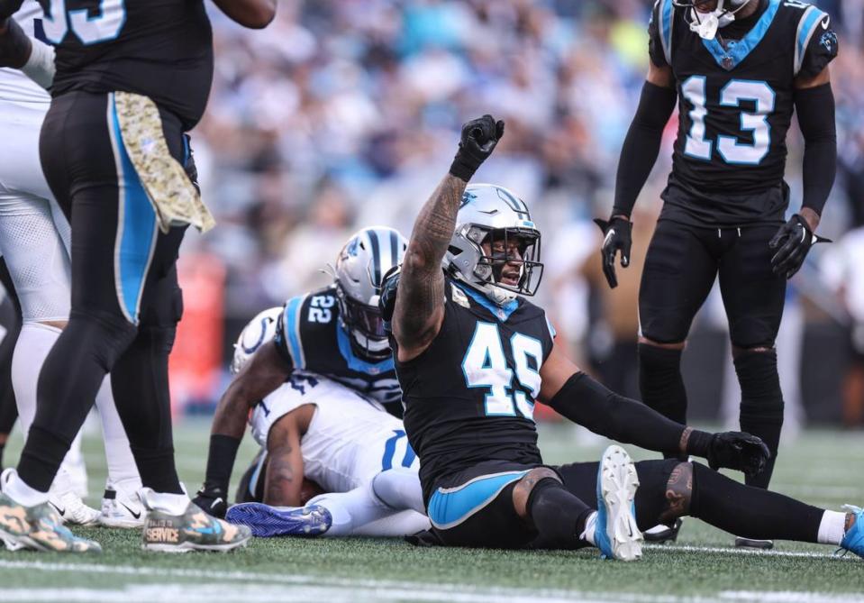 Carolina Panthers linebacker Frankie Luvu raises a fist in the air after tackling Indianapolis Colts wide receiver Josh Downs at the Bank of America Stadium in Charlotte, N.C., on Sunday, November 5, 2023.