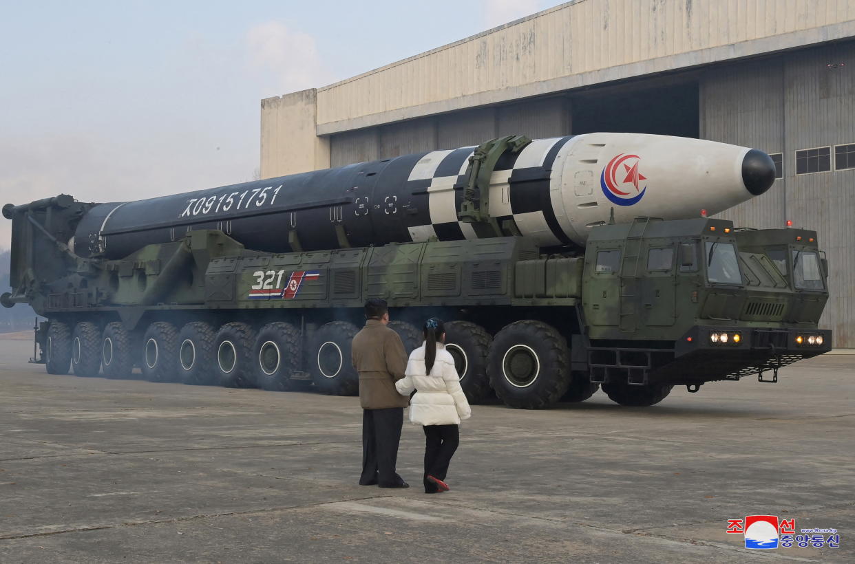 Kim Jong Un, and his daughter, inspect an intercontinental ballistic missile.