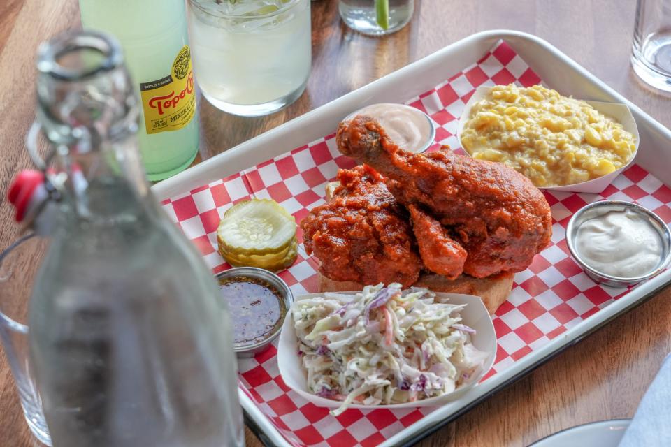 The food at Honeybird Kitchen + Cocktails includes fried chicken and comfort food sides including creamed corn and  buttermilk ranch slaw.