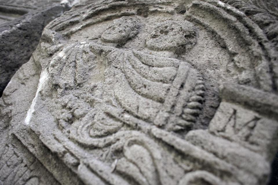 This Friday, Oct. 5, 2012 photo shows mid relief on a Roman tombstone , found on the site of Ratiaria, an ancient Roman settlement located on the banks of the Danube, in the northwest corner of Bulgaria. Located on the crossroads of many ancient civilizations, Bulgarian scholars rank their country behind only Italy and Greece in Europe for the numbers of antiquities lying in its soil. But Bulgaria has been powerless to prevent the rape of its ancient sites, depriving the world of part of its cultural legacy and also costing this impoverished Balkan nation much-needed tourism revenue. (AP Photo/Valentina Petrova)