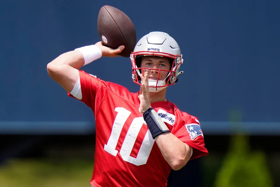 New England Patriots quarterback Mac Jones takes part in drills at the NFL football team's practice facility, Tuesday, June 7, 2022, in Foxborough, Mass.