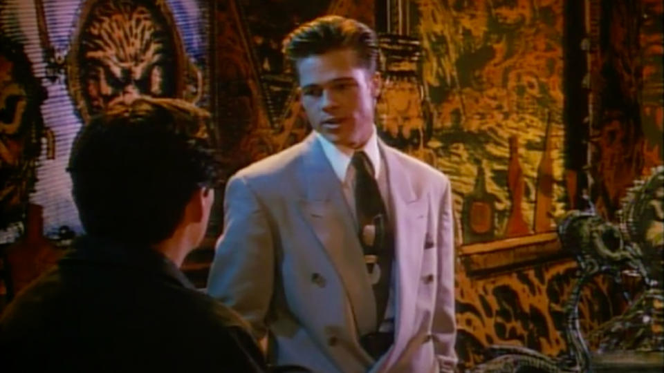 Brad Pitt reprimands Gabriel Byrne in an animated world in Cool World.