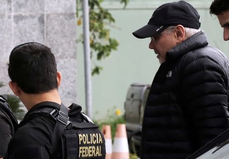 Brazil's former Finance Minister Guido Mantega (R) is escorted by federal police officers as he arrives at the Federal Police headquarters in Sao Paulo, Brazil, September 22, 2016. REUTERS/Nacho Doce