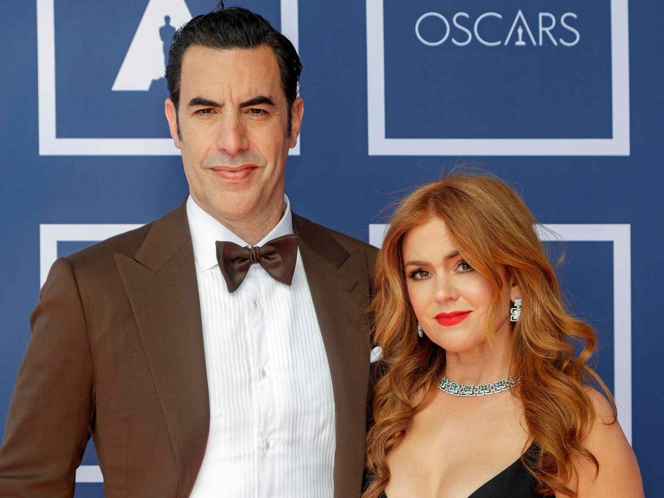 <p>Rick Rycroft-Pool/Getty</p> Sacha Baron Cohen and Isla Fisher.