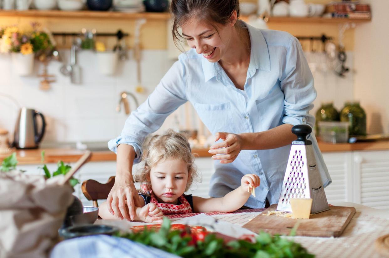 Mom and daughter cooking in the kitchen