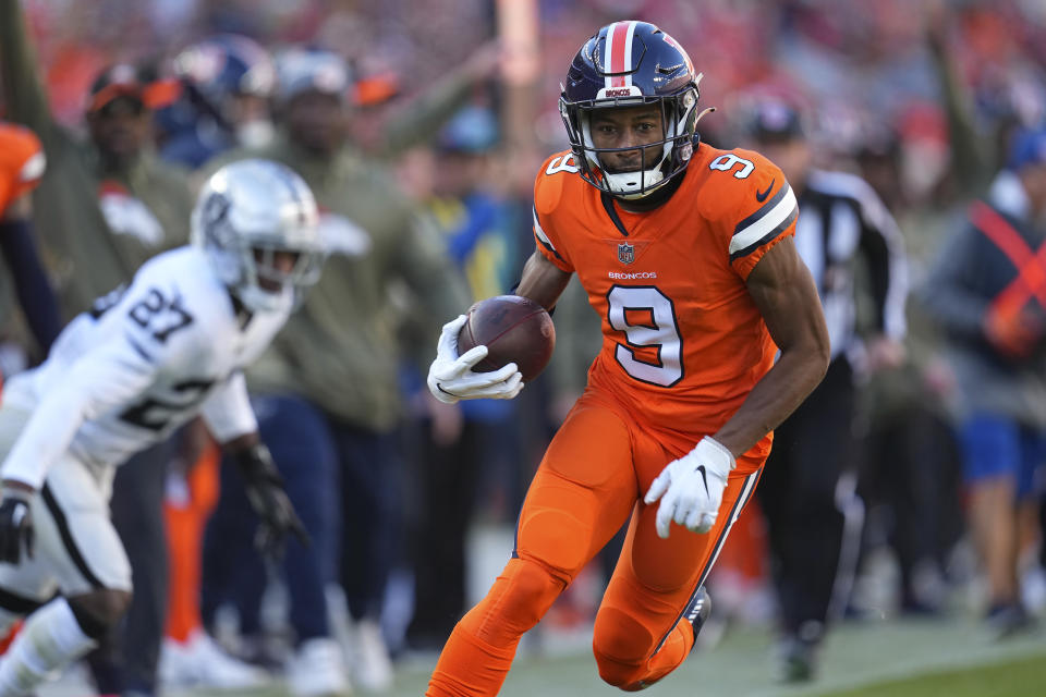 Denver Broncos wide receiver Kendall Hinton (9) runs past Las Vegas Raiders cornerback Sam Webb (27) during the first half of an NFL football game in Denver, Sunday, Nov. 20, 2022. (AP Photo/Jack Dempsey)