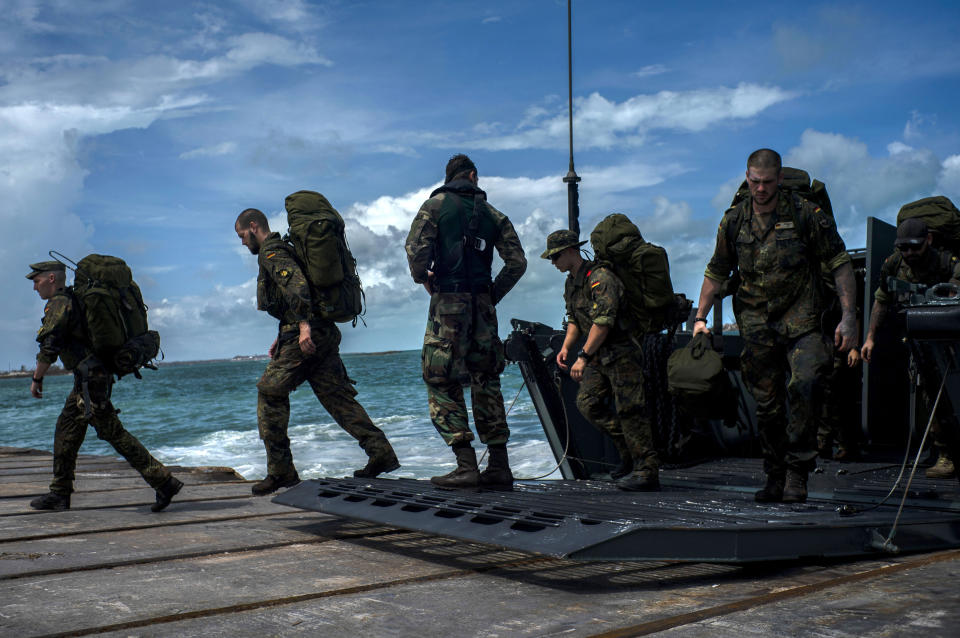 German soldiers disembark at the port to assist in the reconstruction in the aftermath of Hurricane Dorian in Abaco, Bahamas, Monday, Sept. 16, 2019. Dorian hit the northern Bahamas on Sept. 1, with sustained winds of 185 mph (295 kph), unleashing flooding that reached up to 25 feet (8 meters) in some areas. (AP Photo/Ramon Espinosa)