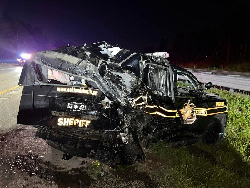 Two deputies were hospitalized after a truck slammed into their cars as they were parked on the freeway behind a car that had been on fire.