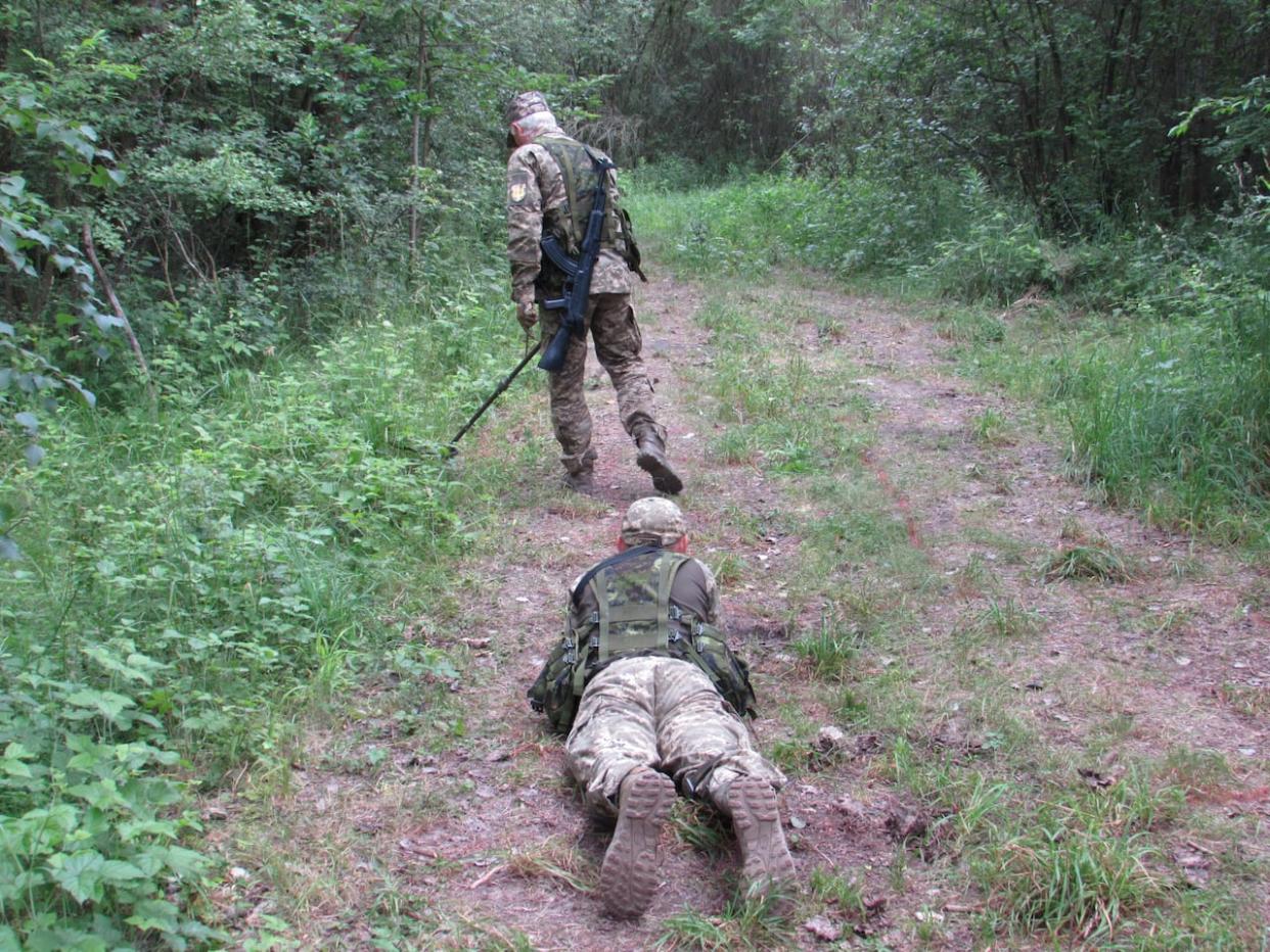 Ukrainian soldiers practice searching for IEDs under the watchful eye of Canadian trainers in southwest Poland on Monday, June 19, 2023. (Bill Graveland/The Canadian Press - image credit)