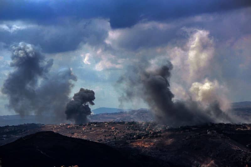 Smoke from heavy Israeli airstrikes rises from the southern Lebanese village of Taibeh. The death toll has risen to 182 people and 727 others were injured in Israeli airstrikes in southern Lebanon, the Lebanese Health Ministry said on Monday. Marwan Naamani/ZUMA Press Wire/dpa