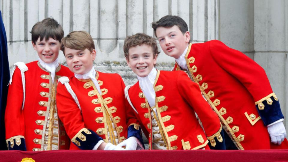 Page of Honour Ralph Tollemache, Prince George of Wales (in his role as Page of Honour), Page of Honour Lord Oliver Cholmondeley and Page of Honour Nicholas Barclay watch an RAF flypast from the balcony of Buckingham Palace following the Coronation of King Charles III & Queen Camilla at Westminster Abbey on May 6, 2023 in London, England