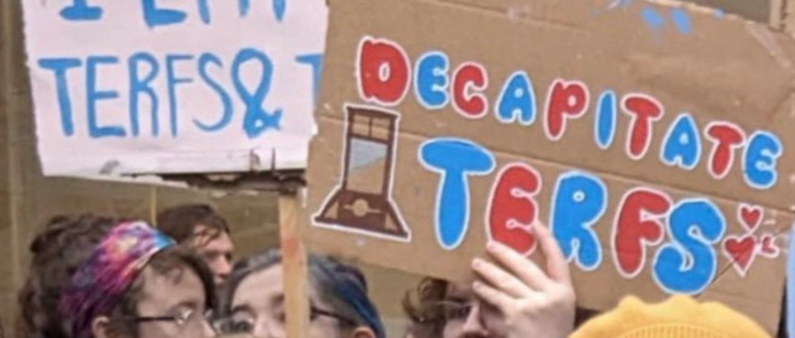 Two SNP politicians were seen appearing to pose next to a sign threatening to 'decapitate TERFs' at a rally in Glasgow. (Twitter/Murdo Fraser))