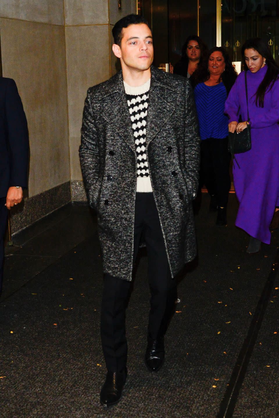 <p>Rami's printed sweater and tailored coat make his casual outfit feel a little more dressed up—without having to try too hard. </p>